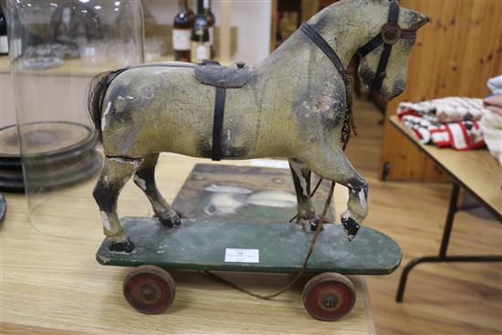 A Victorian painted carved wood pull-along horse